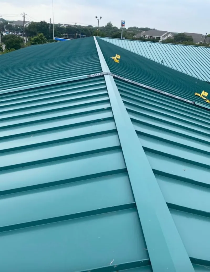 Green commercial metal roof ridge and valley for Metal Roof Repair in Angleton