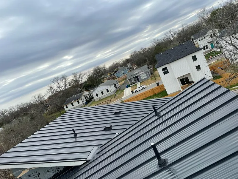 Standing seam metal roof panels with vents for Skylight Repair in Angleton
